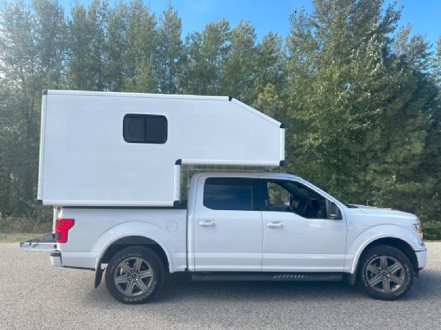 side view of slip in camper mounted in box